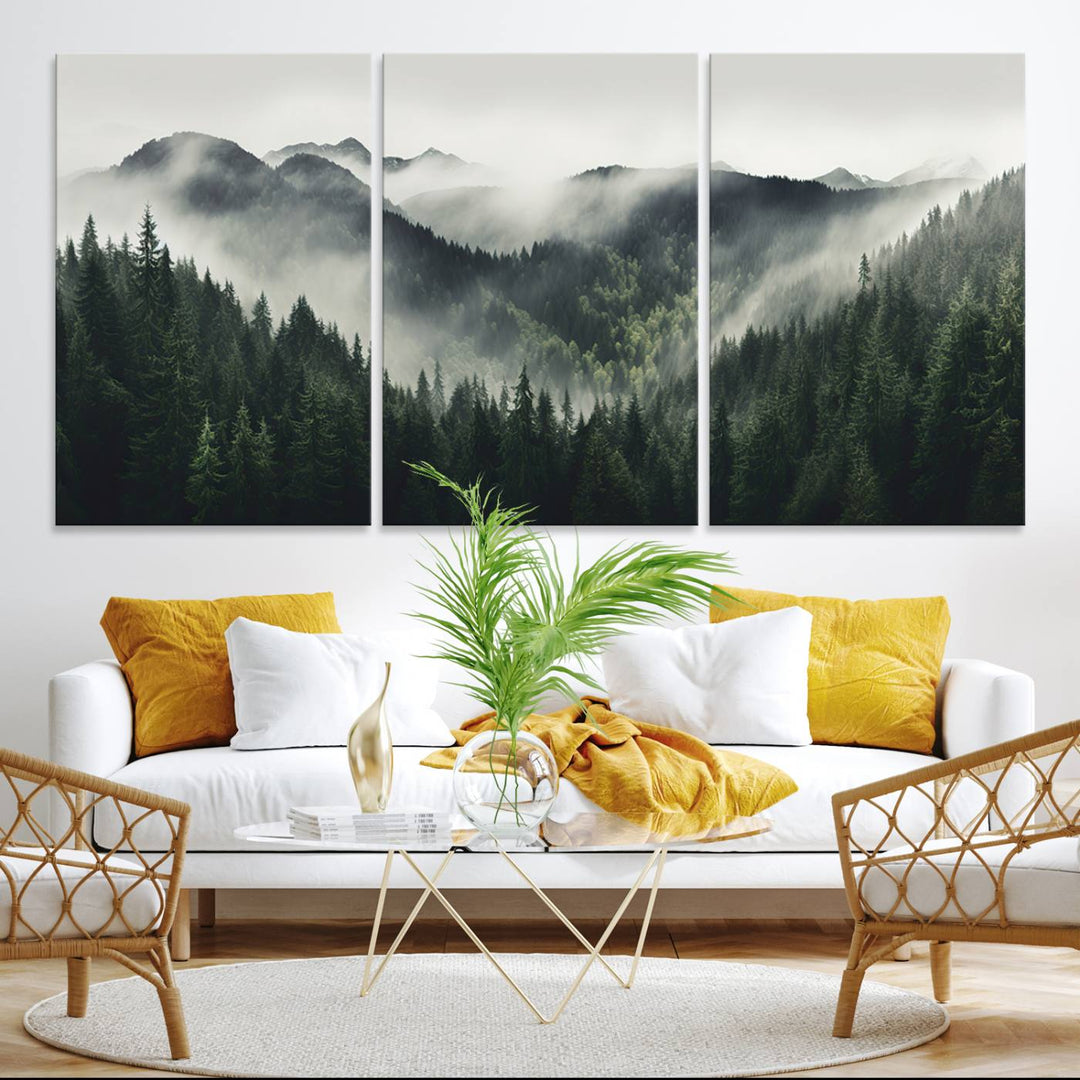 The Misty Forest Canvas Print Wall Art captures a serene misty forest scene with fog and mountains.