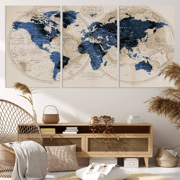 The Vintage Triptych Map Print is a grunge-stained blue and beige world map, perfect for enhancing wall decor.