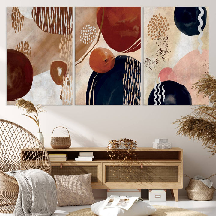 The Boho Neutral Canvas Print Set with earthy tones and circles hangs on the wall.