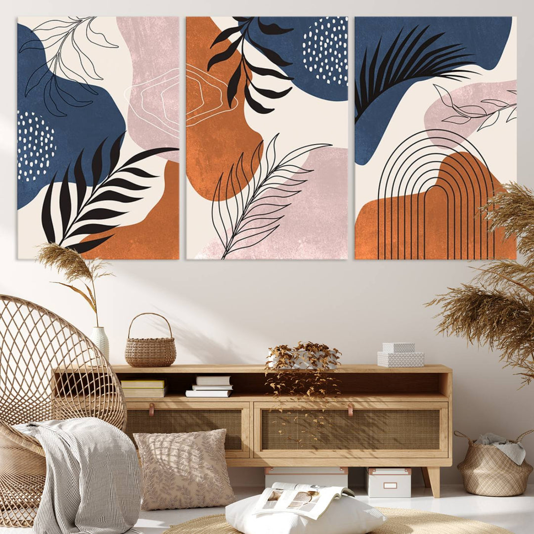 Boho Wall Art Canvas Print Set showcases mid-century geometric and leaf motifs in blue, ochre, and pink.