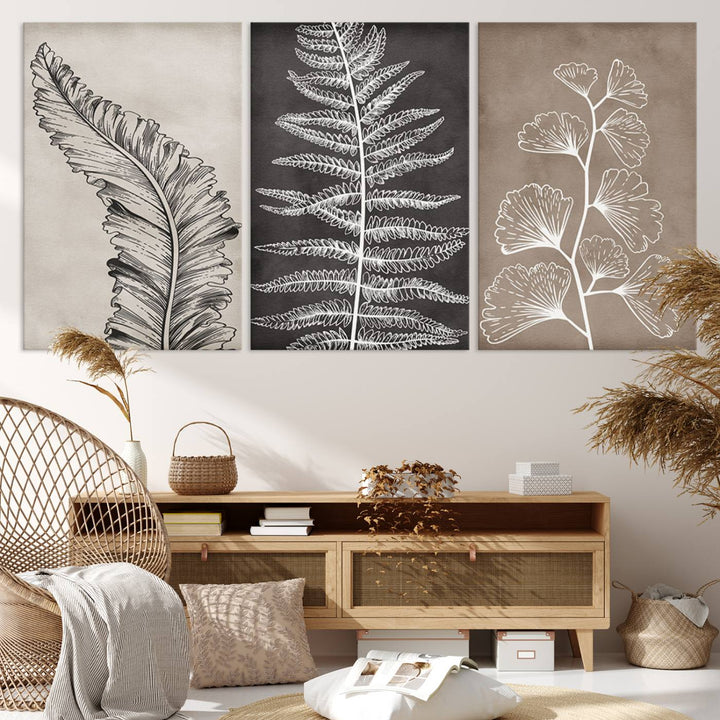 Three framed botanical wall art pieces are displayed in a bright room.