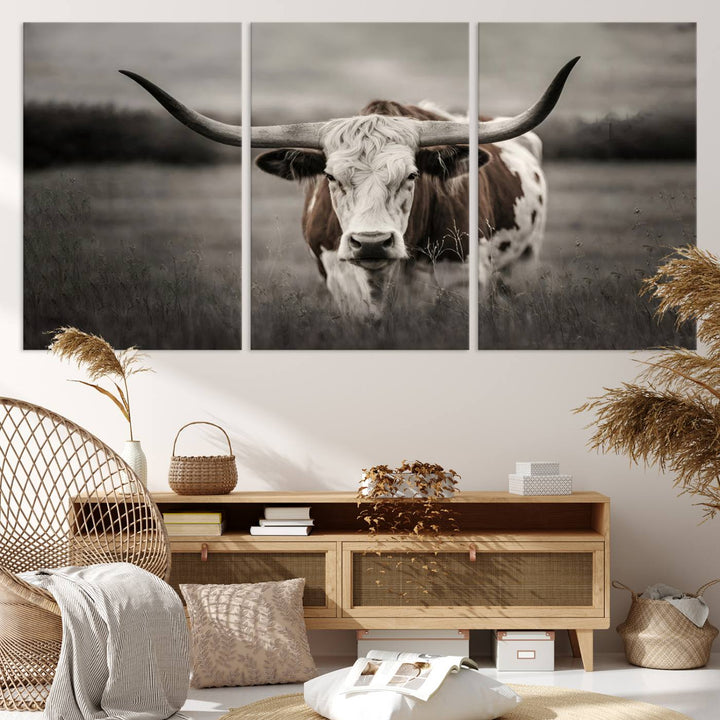 The Texas Longhorn Cow Canvas Wall Art Print adds a rustic touch to a living room.