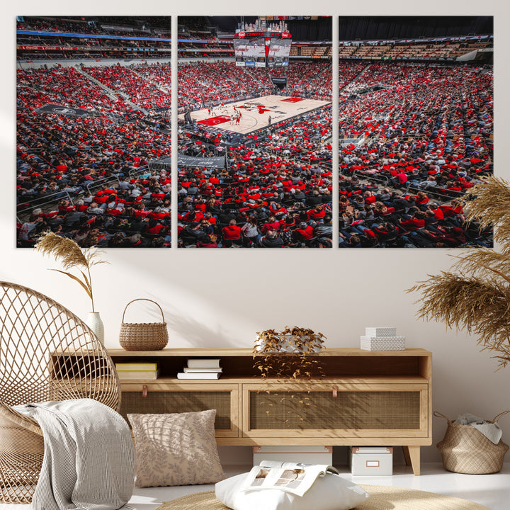 A painting of Louisville Cardinals fans in red at the KFC Yum Center Arena.