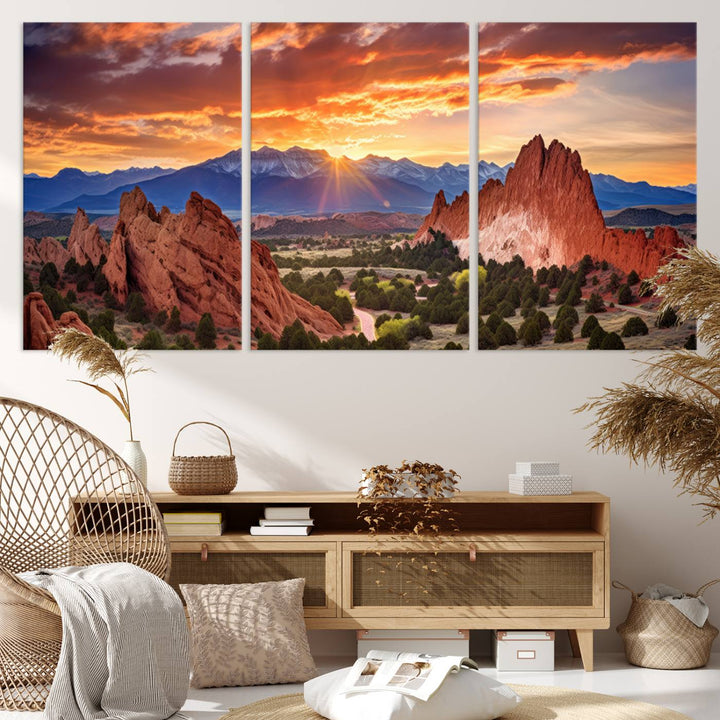 A vibrant sunset over the Rocky Mountains with red rocks.
