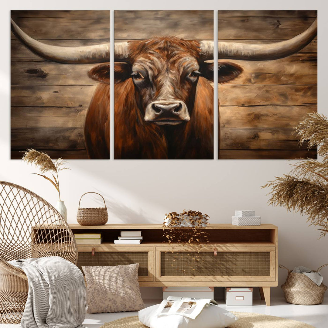 The Longhorn Bull Wall Art, a ready-to-hang canvas print, showcases an image of a brown longhorn cow set against a wooden background, perfect for those looking to enhance their space with rustic farmhouse and western barn decor.