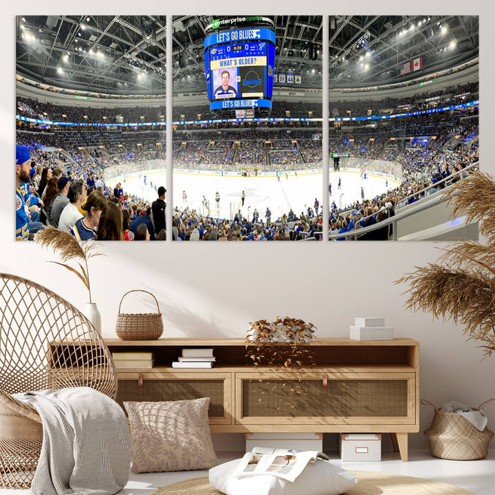 Wall art prints depicting the bustling scenes of the St. Louis Blues being cheered on by a full house at the Enterprise Center, beneath a large scoreboard.