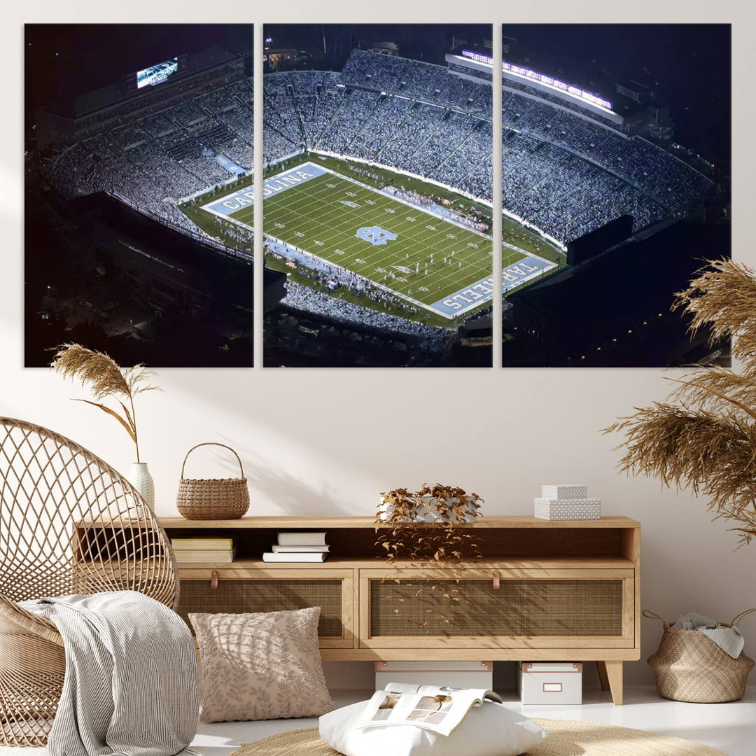 A University of North Carolina Tar Heels Football Team Print, showcasing Chapel Hill's Kenan Memorial Stadium, hangs in a modern dining room, adding a gallery-quality finish that enhances the entire space.