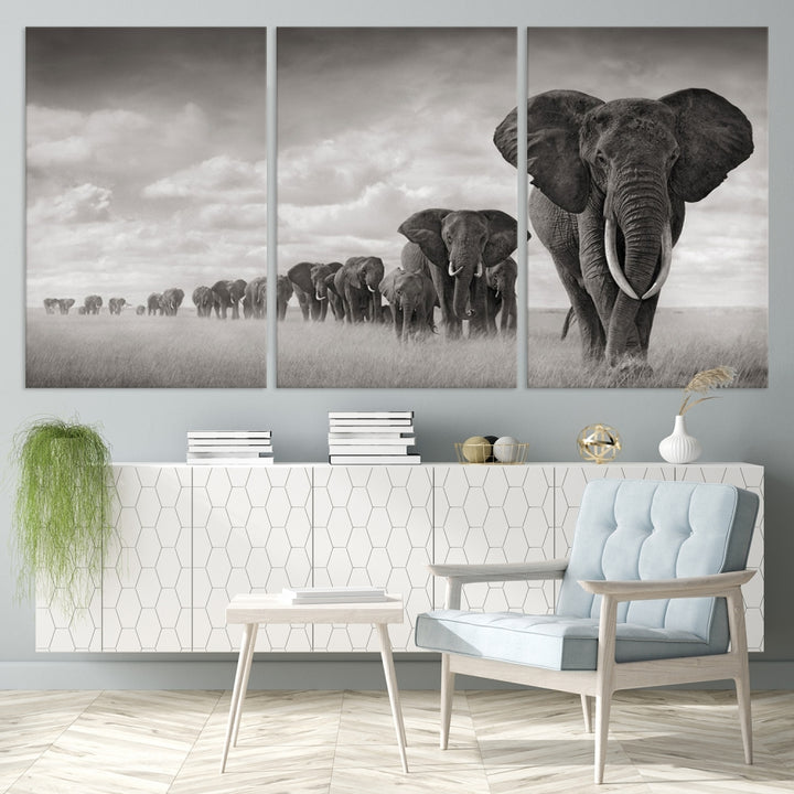 The Elephant Wall Art Canvas Print features a triptych of elephants in a savanna, elegantly displayed.