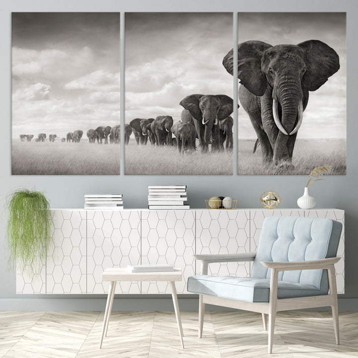 The "Herd of Elephants Wall Art Canvas Print" features an elegant black and white triptych of elephants walking in a line, beautifully displayed on museum-quality canvas with a UV-protective coating. This artwork arrives ready to hang and adds sophistication to any space.