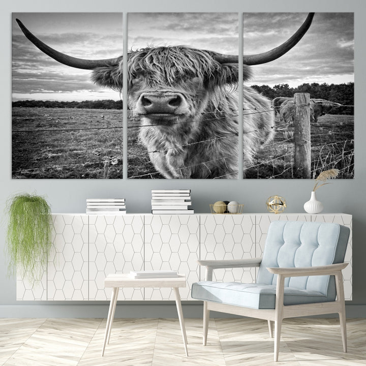 The "Scottish Highland Cow Canvas Wall Art Farmhouse Decor" adds a touch of rustic charm to your living room wall above the couch.