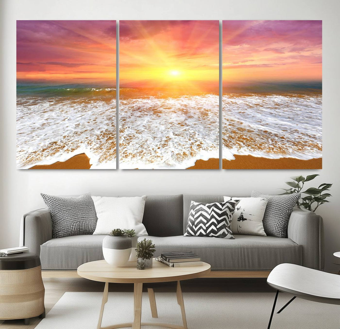 Golden Beach Sunrise 3-panel canvas art of ocean waves, hung on a wooden wall.