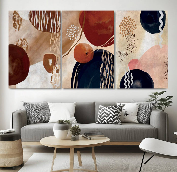 The Boho Neutral Canvas Print Set with earthy tones and circles hangs on the wall.