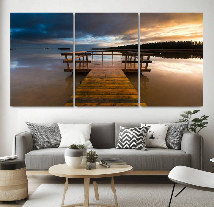 The "Serene Lake Pier at Sunset" landscape canvas print, crafted as ready-to-hang and framed wall art, enriches the contemporary setting by capturing the tranquility of a lakeside pier at sunset.