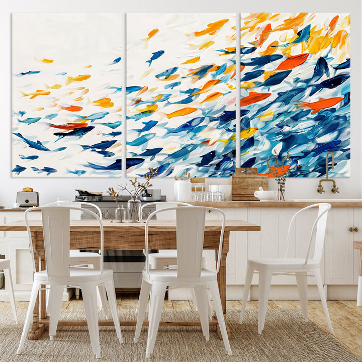 A colorful Abstract Fish Shoal Canvas Print hangs on the wall.