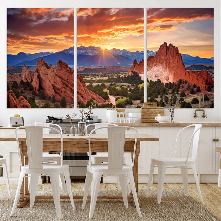 A vibrant sunset over the Rocky Mountains with red rocks.