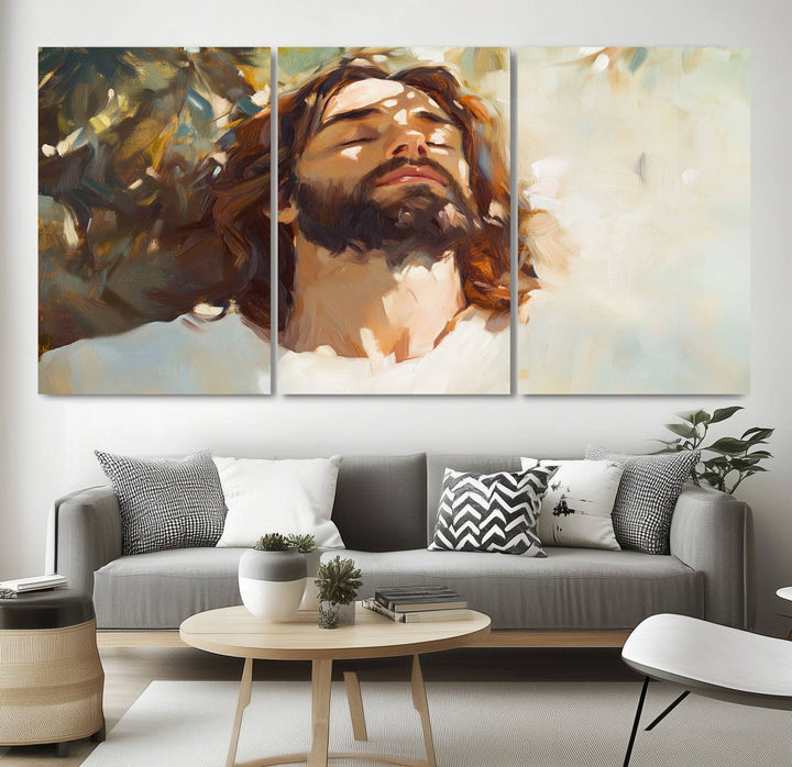 The Jesus Portrait Wall Art Canvas Print features a depiction of Jesus Christ with closed eyes, basking in sunlight. His expression exudes a peaceful, spiritual atmosphere against a blurred background.