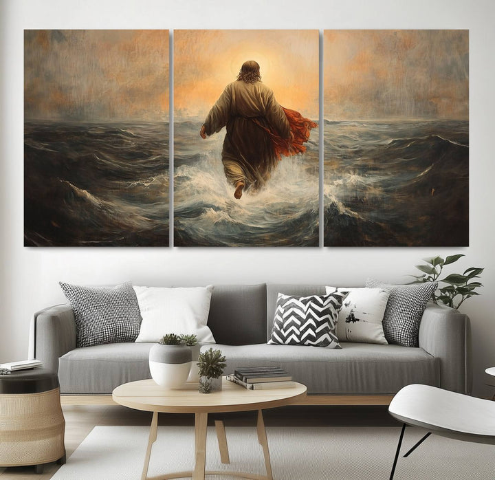 A modern living room is adorned with a triptych titled "Jesus Walking on Water, Christian Wall Art, Jesus Christ Walking on Oil Painting Style Print." The artwork, presented on museum-quality canvas, showcases vibrant colors and exquisite detail.