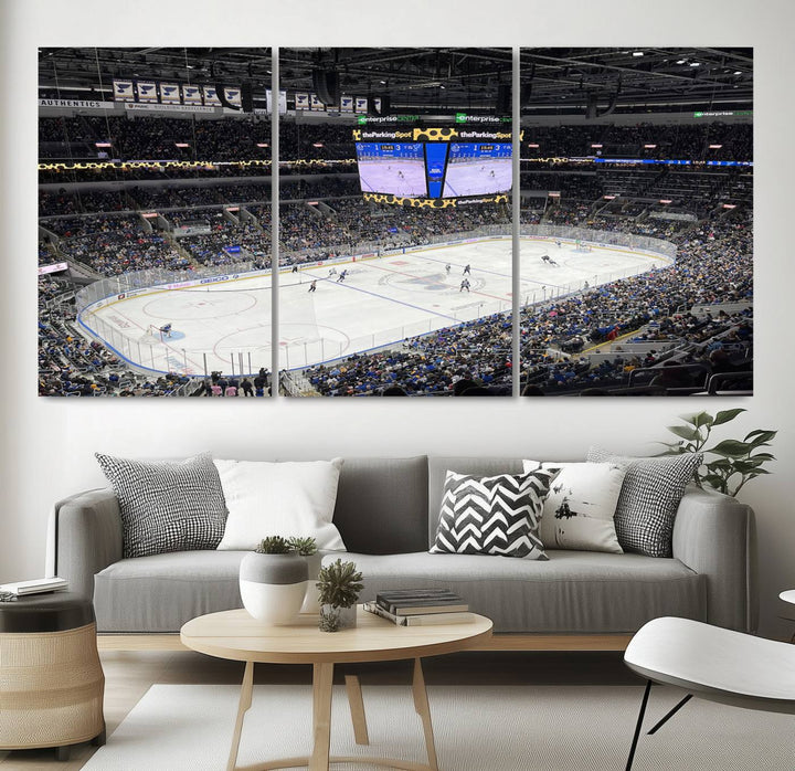 A large Enterprise Center canvas of a crowded hockey arena hangs prominently.