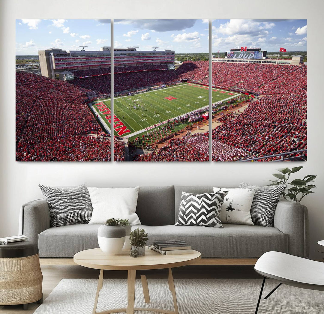 The University of Nebraska Cornhuskers Football Team Print showcases a vibrant triptych of Lincoln Memorial Stadium, depicting a packed football stadium filled with energetic fans. This handmade art piece is crafted in the USA and printed on premium canvas for a gallery-quality finish.