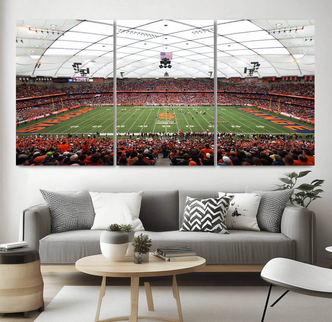 Fans fill the Syracuse JMA Wireless Dome, highlighted in orange and blue under a vaulted roof on this premium canvas print of the scene.