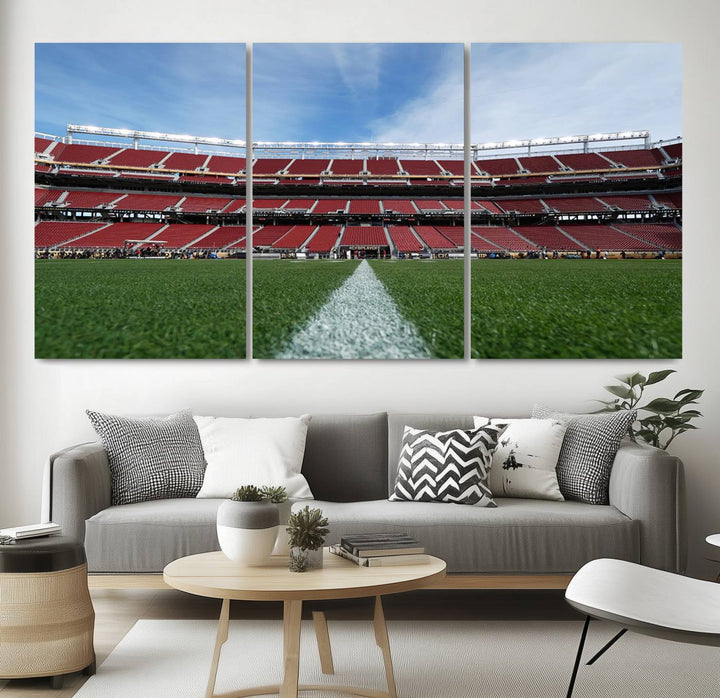 A canvas print of the University of Tulsa Golden Hurricane showcases H.A. Chapman Stadiums football field and red seats against a backdrop of a blue sky.