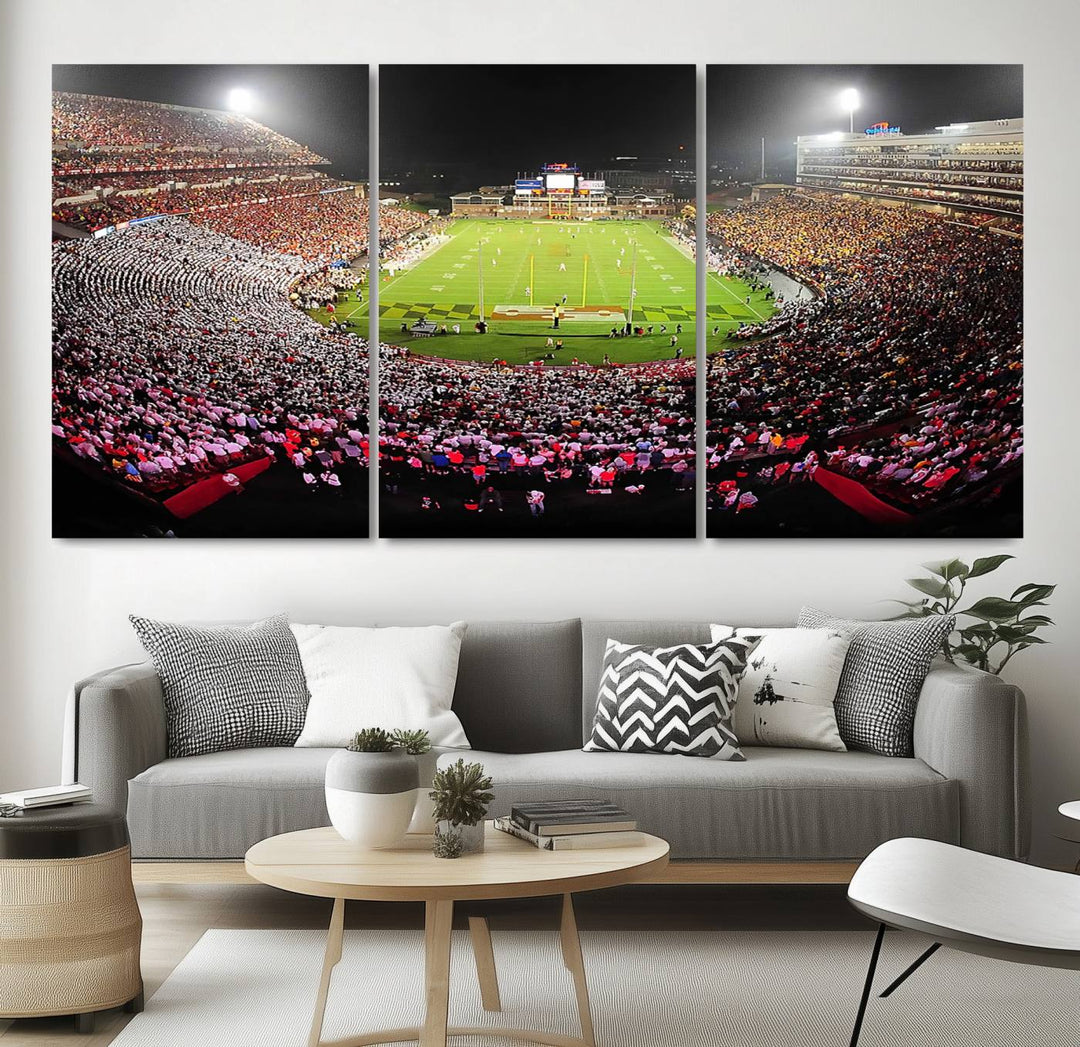 The Maryland Terrapins Football Wall Art Canvas showcases a packed SECU Stadium at night with a bright field and cheering fans.