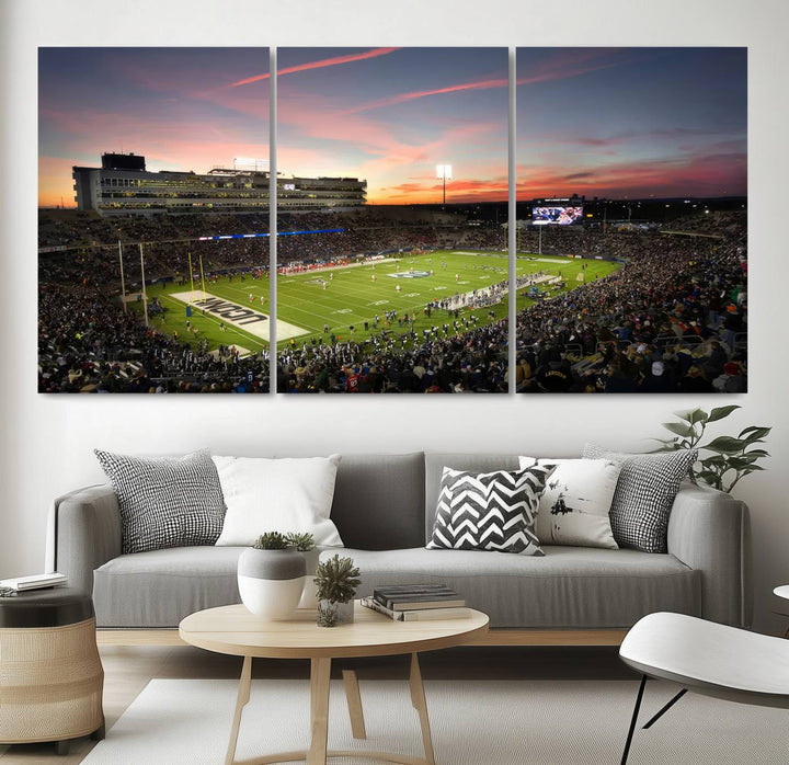 This wall art canvas print captures UCONN Huskies fans energizing a sunset scene at East Hartfords Pratt & Whitney Stadium.