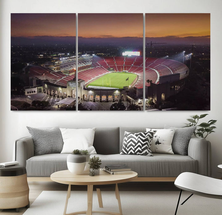 The USC Trojans Stadium canvas captures Memorial Coliseum at twilight, showcasing red seats and a green field beneath an orange sky.