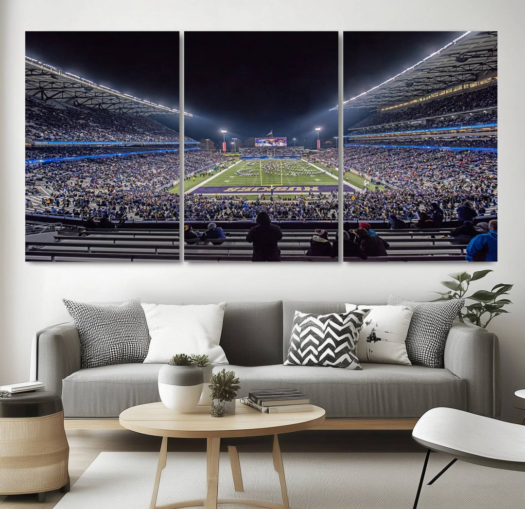 A canvas print titled The University of Washington Huskies Football depicts a packed Husky Stadium at night, as seen from the stands.