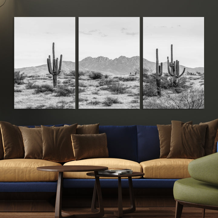 The modern living room showcases the "Black White Arizona Desert Canvas Wall Art Cactus Farmhouse Wall Art," a triptych consisting of gallery-wrapped, museum-quality black-and-white desert landscape photographs featuring cacti.