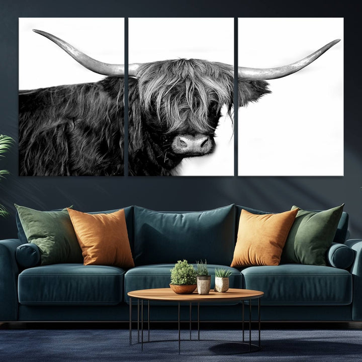 The Black and White Highland Cow Multi Panel Wall Art Canvas Print with UV-protection hangs prominently.