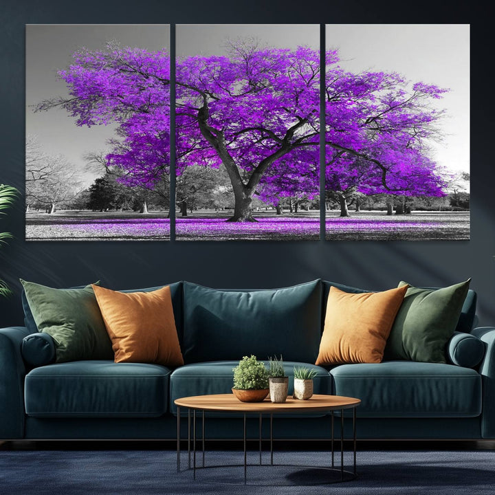 The Big Purple Tree Wall Art Canvas Print showcases a vibrant purple tree set against a black-and-white landscape.