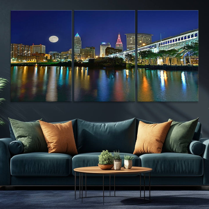 Cleveland City Lights Night Skyline Wall Art canvas showcases a moonlit cityscape reflected on water.