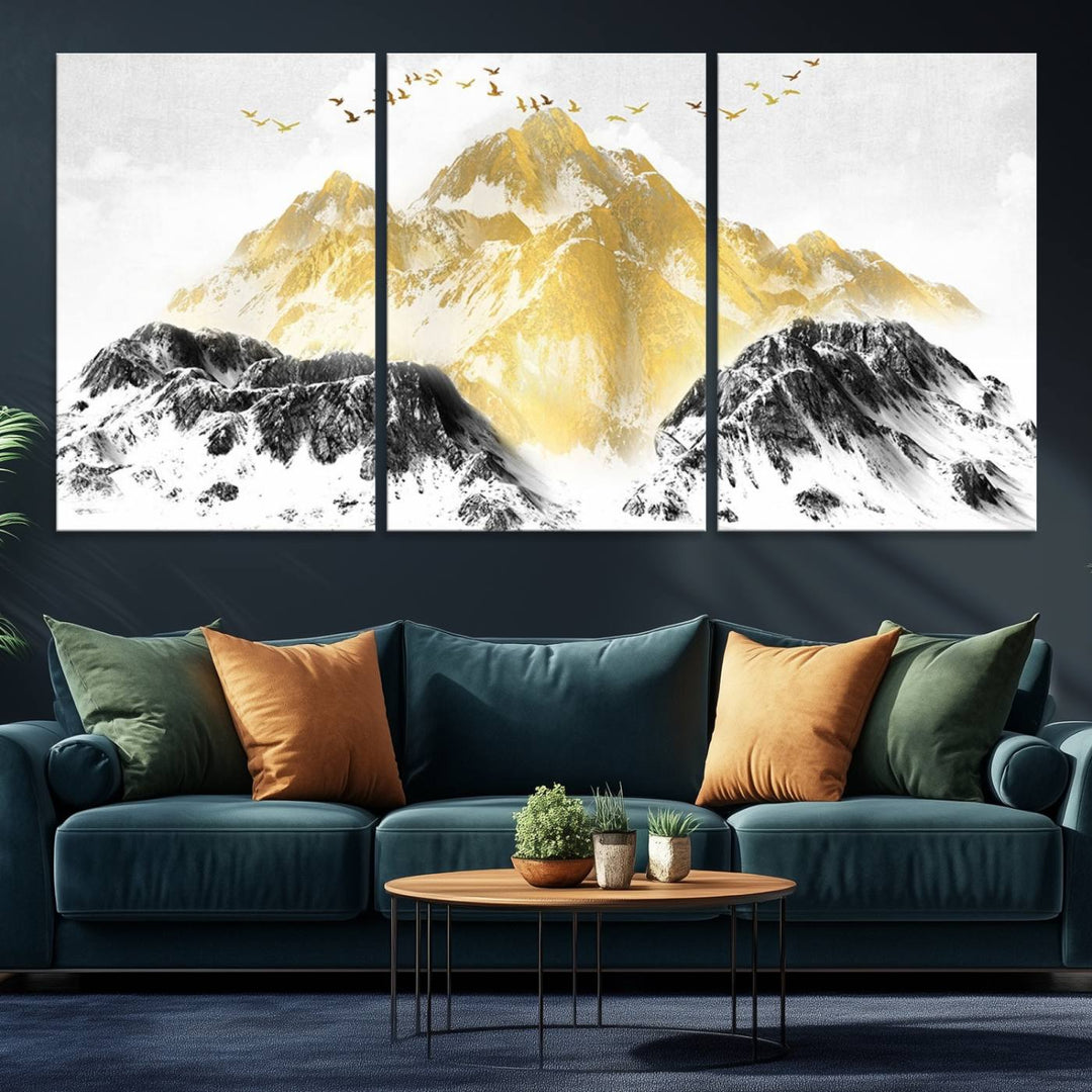 Golden Mountain Triptych Wall Art features gold-tinted mountains and birds.