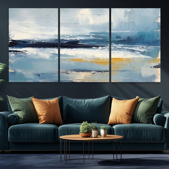 The Abstract Ocean Canvas Wall Art in coastal blue and gold enhances the modern kitchen.