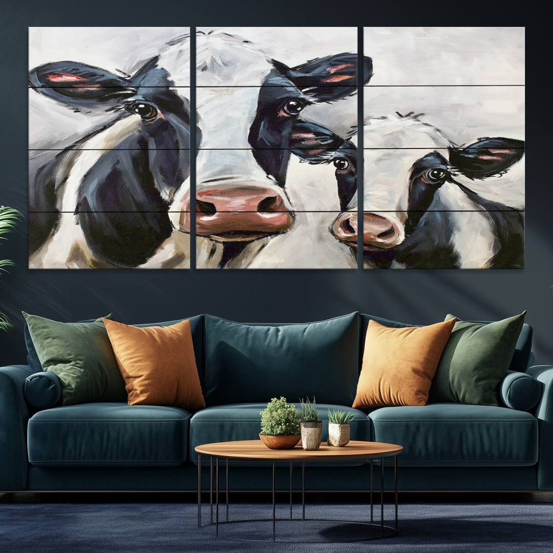 The Vintage Baby and Mom Cattle Canvas, featuring cows with black and white patches, is a prominent piece of wall art.