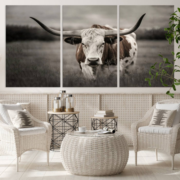 The Texas Longhorn Cow Canvas Wall Art Print adds a rustic touch to a living room.