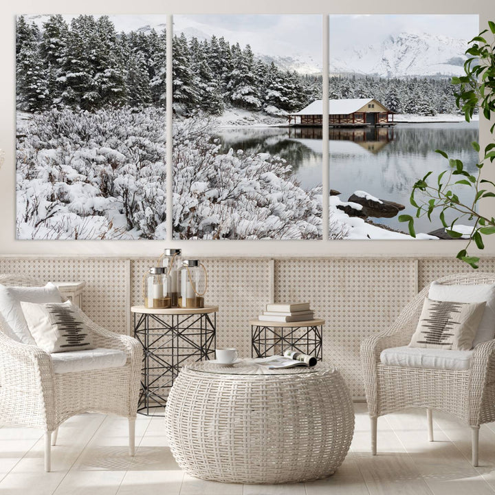 Experience the beauty of winter with the "Cabin by the Lake Canvas Wall Art," showcasing a serene snowy landscape. This rustic nature decor features a cozy cabin nestled amid snow-laden trees, set against a breathtaking mountain view, perfect for enhancing your living room.