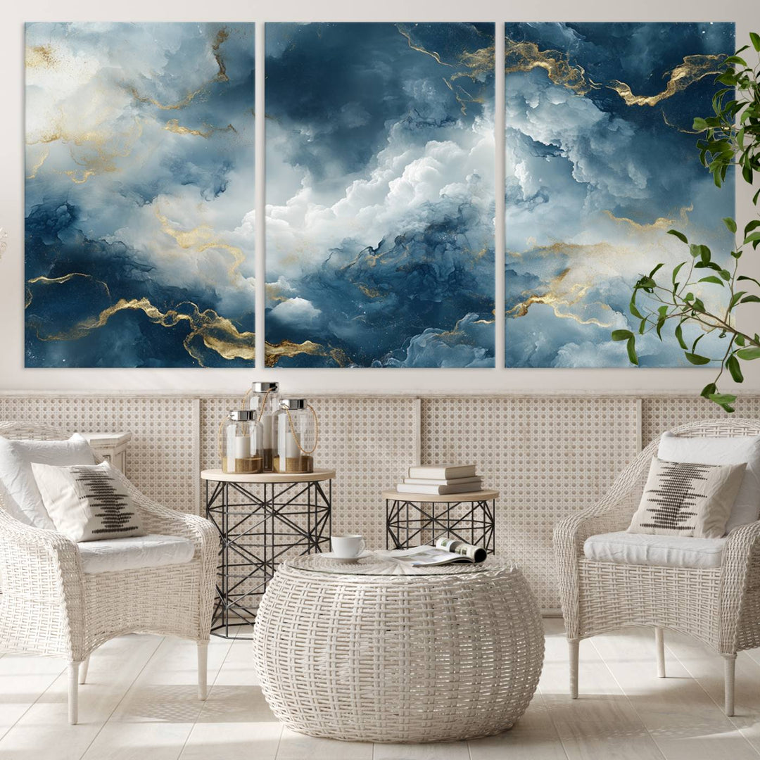 Modern living room featuring the Large Abstract Print - Luxe Blue and Gold Abstract Canvas Wall Art that showcases a bold cloudscape, perfect for modern home decor.