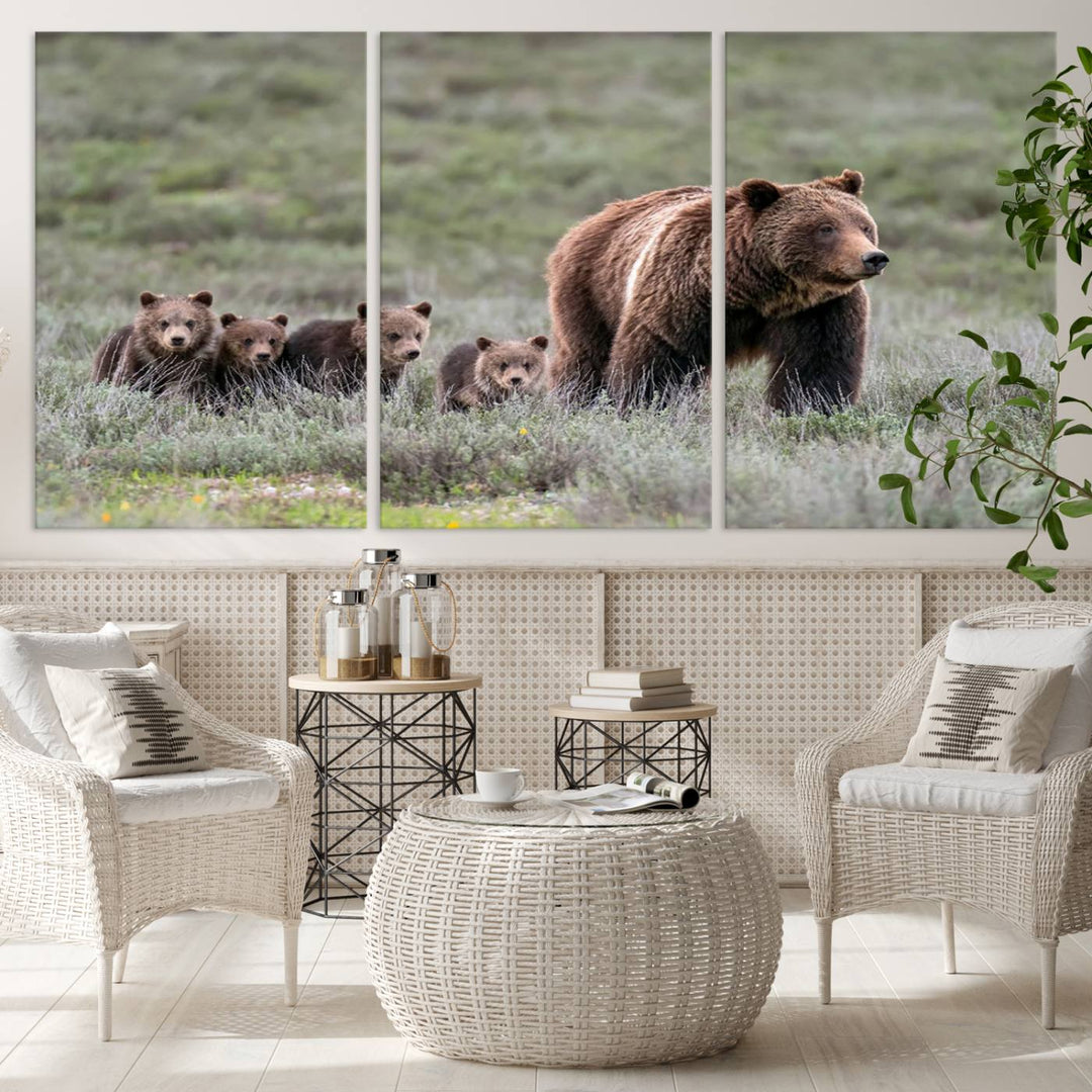 The large canvas print titled "Queen of the Tetons, 399 Grizzly Bear Cubs" showcases majestic wildlife photography of a bear and her cubs walking through the grass. This stunning canvas wall art, handmade in the USA, adds a charming touch to any room with its rustic decor appeal.