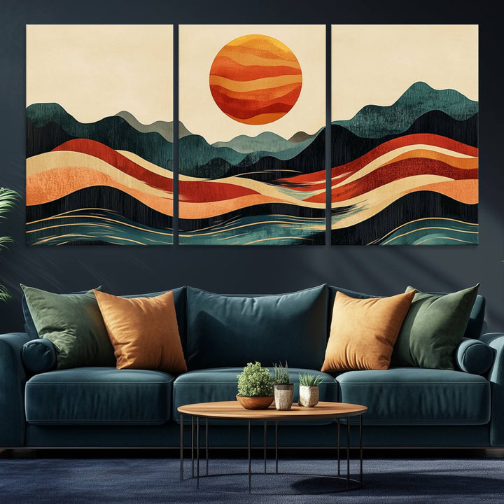 The Mountain Triptych wall art, featuring a design of the sun, mountains, and waves, is displayed prominently on the wall.