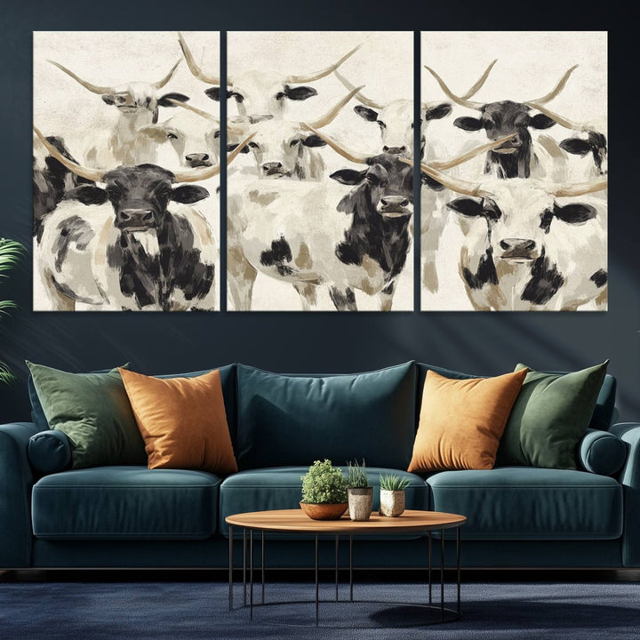 Canvas print titled Longhorn Texas Cow Drawing, depicting longhorn cattle with black and white markings, made in the USA, displayed on the wall.