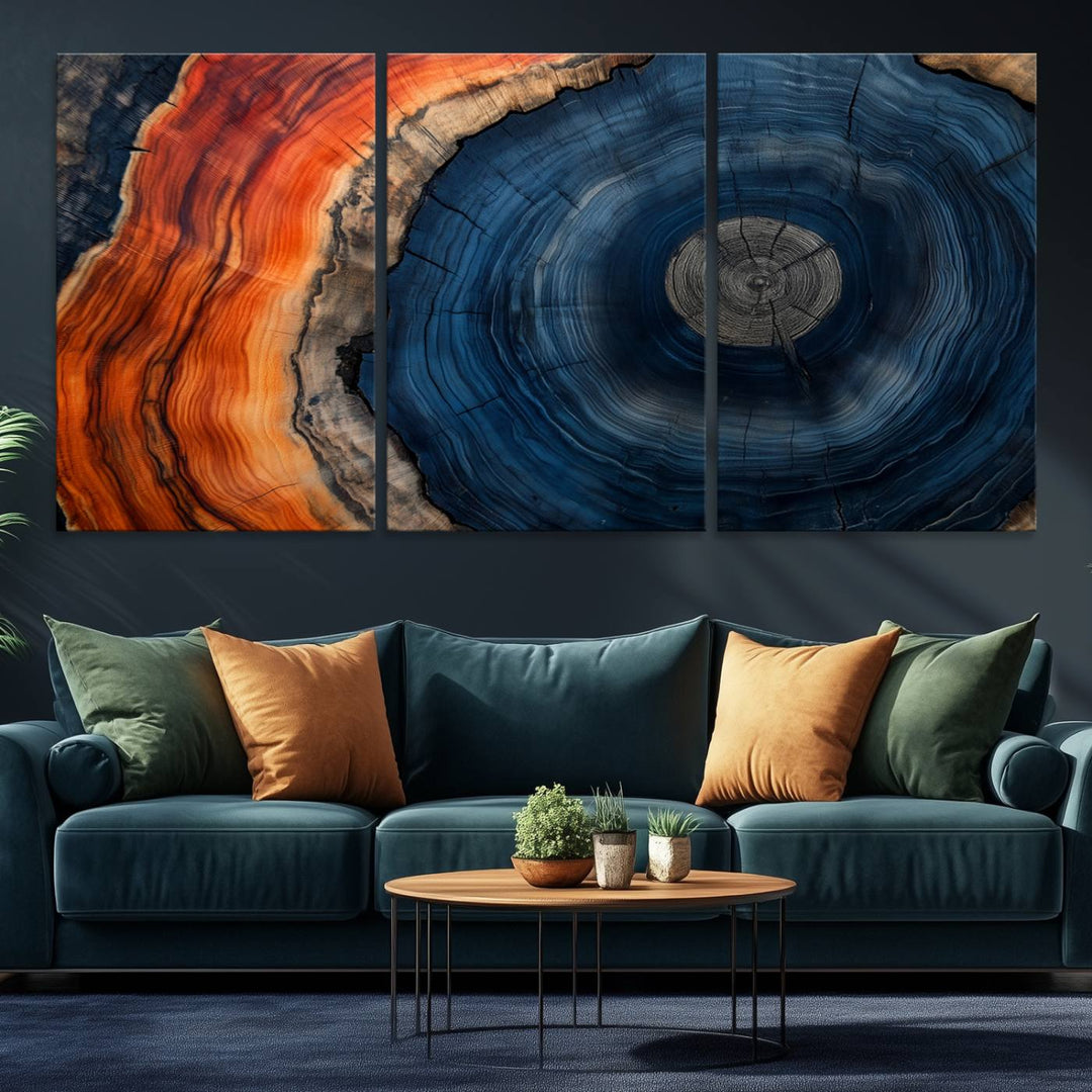 Abstract Tree Ring Wall Art Print on canvas featuring vibrant blue, orange, and brown rings with a natural rustic wood texture. Free shipping available!.