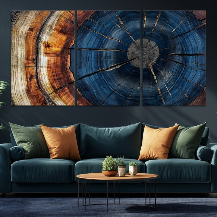 The Abstract Tree Rings Canvas Print features blue, brown, and orange rings that highlight wood grain and natures beauty.