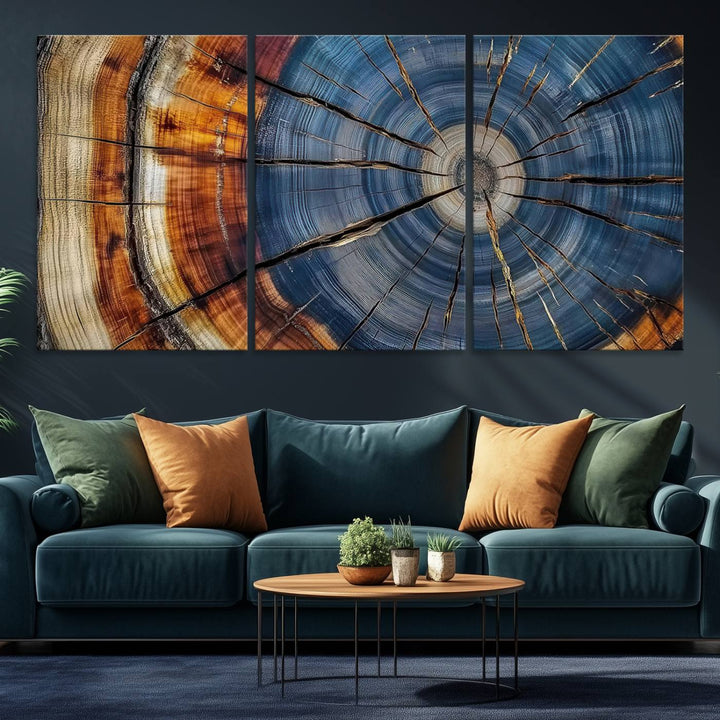 Close-up of blue, brown, and orange wood grain rings on the Abstract Tree Rings Canvas Wall Art Print.