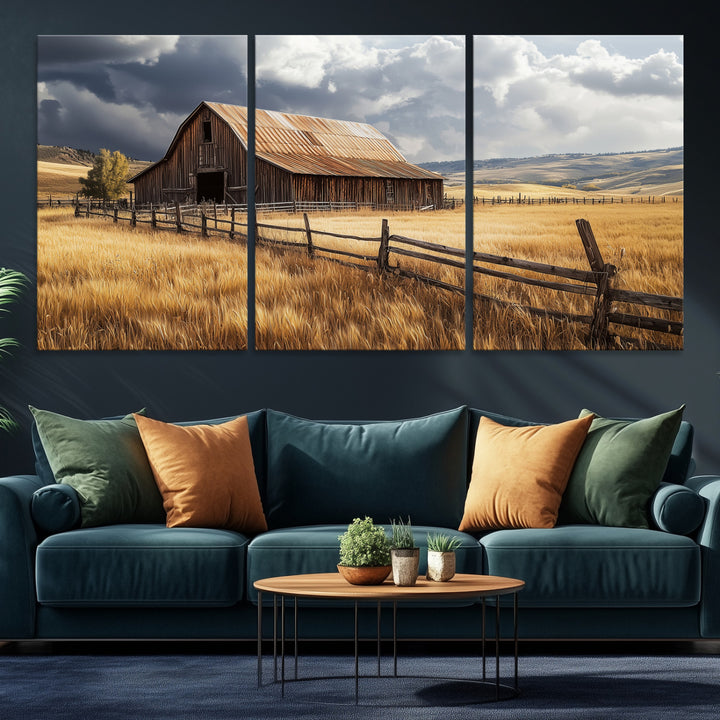 Canvas of a weathered wooden barn in a golden field under a dramatic sky, perfect for rustic or farmhouse-style wall decor.