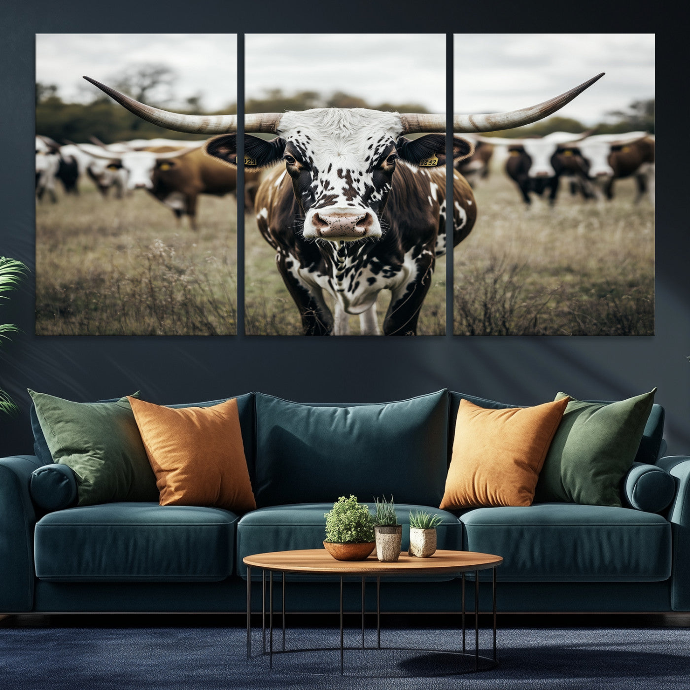 Canvas of a speckled Texas longhorn standing boldly in a field with a herd behind, perfect for rustic western or farmhouse wall decor.