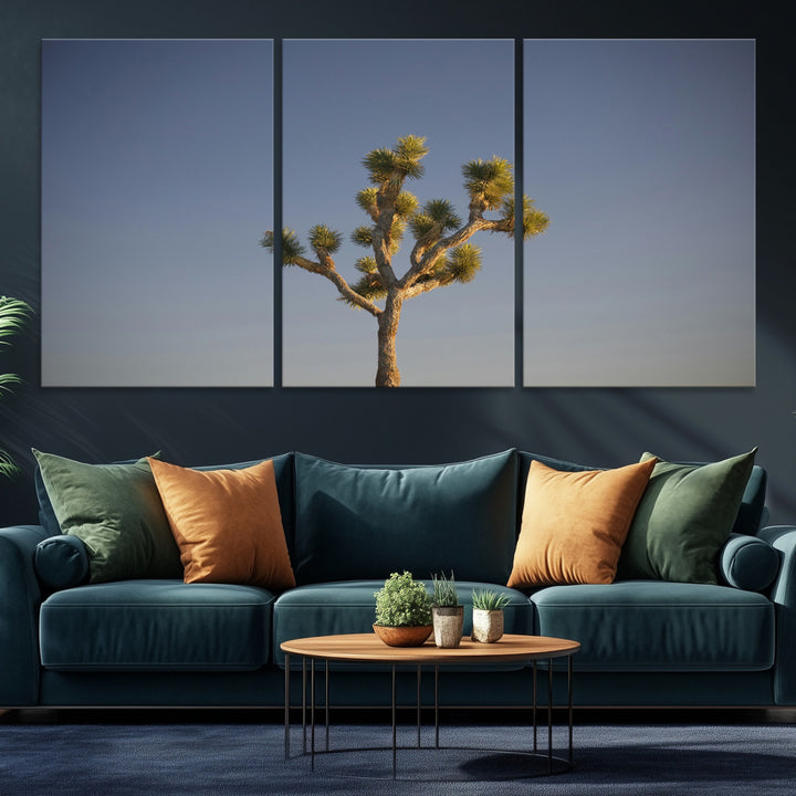 A lone Joshua Tree standing against a deep blue sky, capturing the serene and rugged beauty of the Southwestern desert landscape.