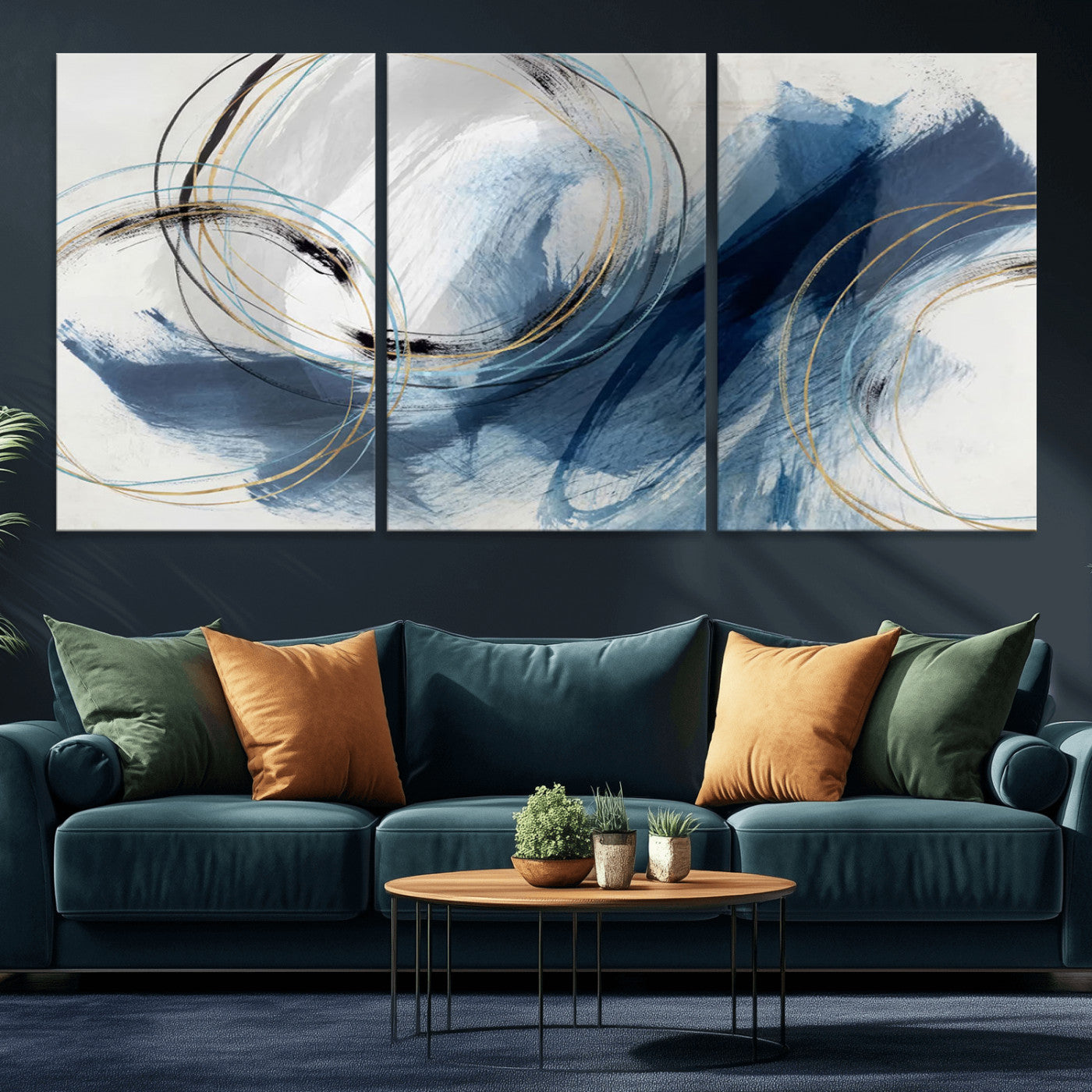 Abstract wall art featuring dynamic brush strokes in shades of blue and gray, overlaid with delicate circular line patterns in gold, black, and light blue on a white background.