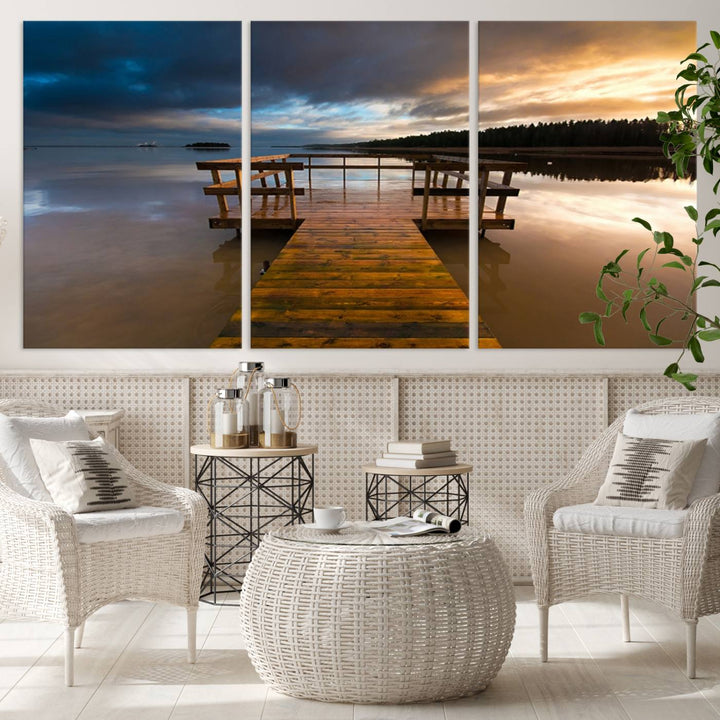 The "Serene Lake Pier at Sunset" landscape canvas print, crafted as ready-to-hang and framed wall art, enriches the contemporary setting by capturing the tranquility of a lakeside pier at sunset.